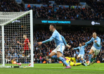 Soccer Football - Premier League - Manchester City v Manchester United - Etihad Stadium, Manchester, Britain - March 3, 2024 Manchester City's Phil Foden celebrates scoring their second goal with Erling Braut Haaland REUTERS/Carl Recine